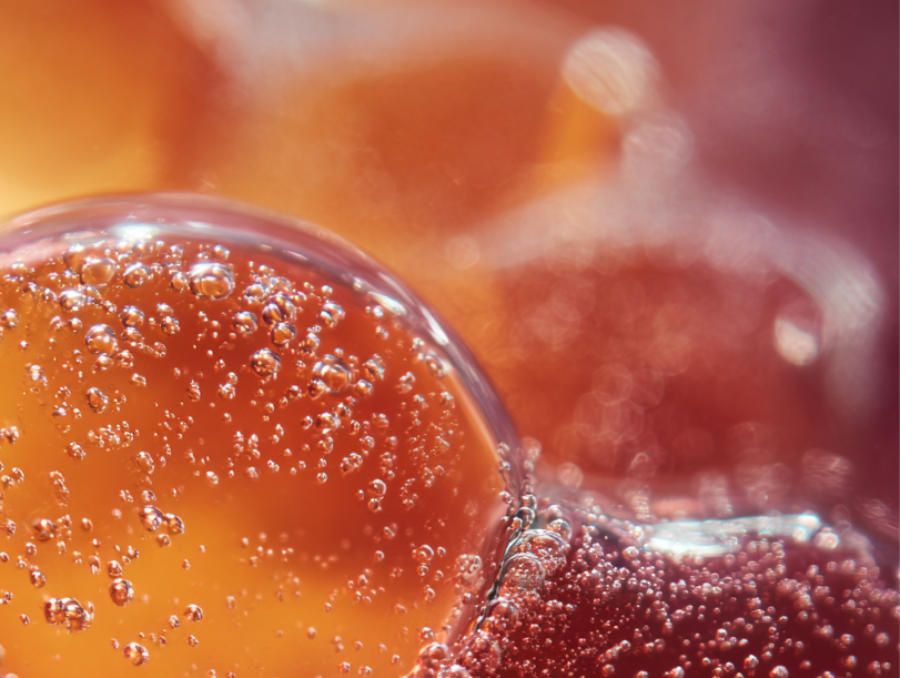 Close-up of bubbles in a liquid with a blurred background